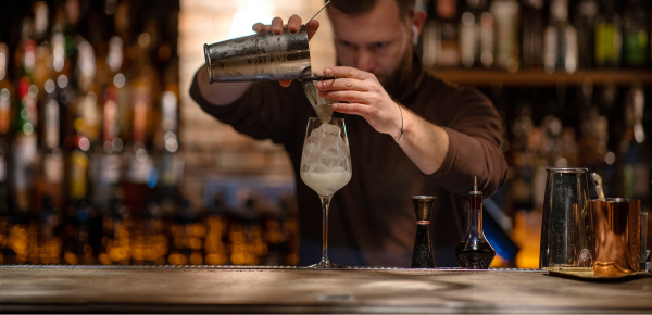 Image of a mixologist preparing a cocktail